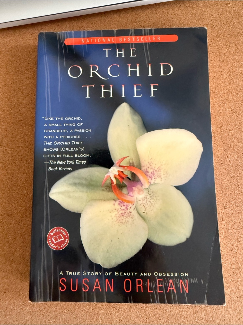 The Orchid Thief by Susan Orlean - Black Cover with Pale Green Orchid